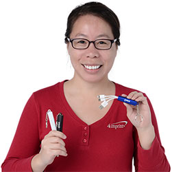 Mai See holding the Route Light-Up Logo Duo Charging Cable