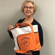 Woman holding the Color Bright Tote