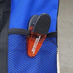 Power Clip Translucent clipped to the pocket of a bag