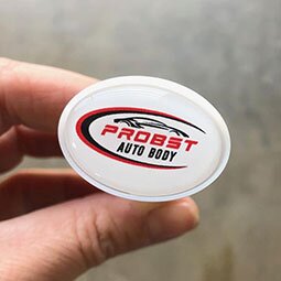 Person holding the Vivid Vent Air Freshener Oval